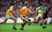 25 July 1999; Seamus McMulllan, Antrim in action against Johnny Pilkington, Offaly, Offaly v Antrim, All Ireland Hurling Quarter Final, Croke Park. Picture credit; Ray McManus/SPORTSFILE