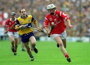 4 July 1999; Timmy McCarthy, Cork, in action against Liam Doyle, Clare. Cork v Clare, Munster Senior Hurling Final, Semple Stadium, Thurles. Picture credit; Damien Eagers/SPORTSFILE
