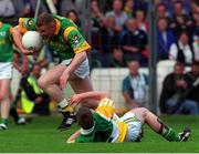 4 July 1999; Tommy Dowd, Meath comes away from the tackle of Offaly's Cathal Daly. during the Meath v Offaly Leinster Football Championship, at Croke Park, Dublin. Picture credit; Matt Browne/SPORTSFILE.
